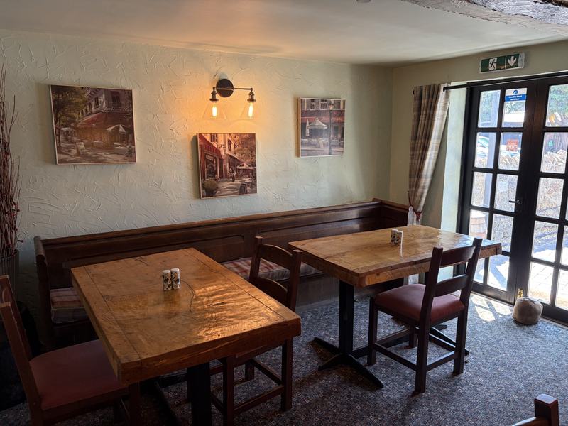 Dining tables beside the French doors to the garden